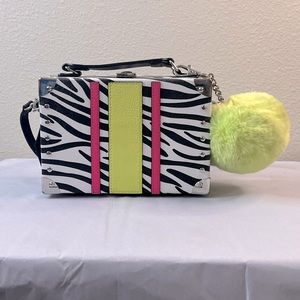 Neon zebra bag with detachable keychain.It is black and white with neon strips.